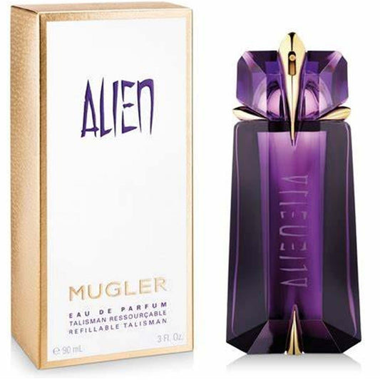 Alien Mugler - MANZARA STORE - Perfume Available at MANZARA STORE - Alien Mugler - Alien Mugler, All Products, Woman- Alien Eau De Parfum by Mugler Product Description: Step into a world of mystery and allure with Alien Eau De Parfum by Mugler. This enchanting fragrance is designed for the woman who radiates confidence and power. With its captivating blend of floral, woody, and amber notes, Alien is a bold and unforgettable scent that transcends time and space, creating an aura of elegance and mystery where