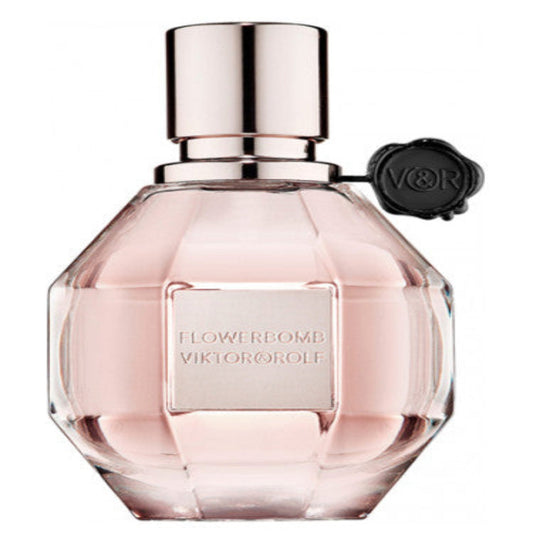 Flowerbomb Viktor&Rolf for women - MANZARA STORE - Perfume Available at MANZARA STORE - VICTOR&ROLF - All Products, Victor&ROLF, Woman- Flowerbomb Eau De Parfum by Viktor&Rolf Product Description: Flowerbomb Eau De Parfum by Viktor&Rolf is an explosion of floral elegance and sophistication. This luxurious fragrance combines an enchanting bouquet of floral notes with warm, sensual undertones, creating a captivating and long-lasting scent. Designed for the modern, confident woman, Flowerbomb is perfect for ev